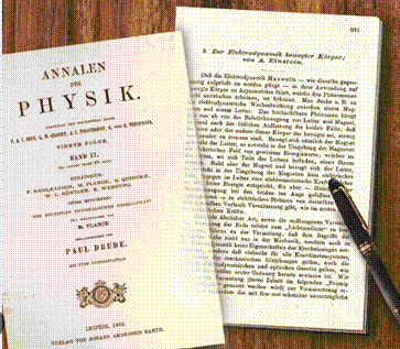 A book and pen on a tableDescription automatically generated