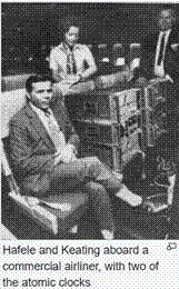 A person sitting in a chair with a person in the backgroundDescription automatically generated